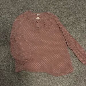 Blush colored top with bow accent.